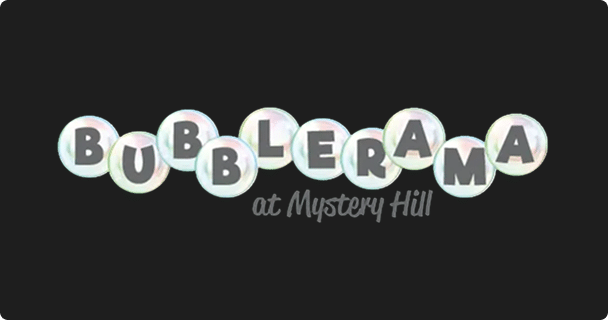 Text reads BUBBLERAMA in large white bubble-like letters, with at Mystery Hill in smaller, gray script below, all on a dark background.