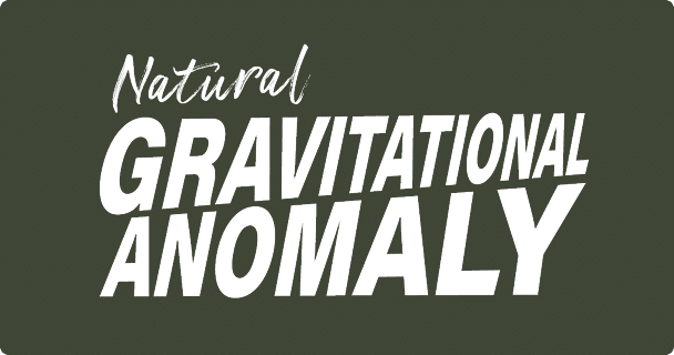 White text on a dark green background reads Natural Gravitational Anomaly, with Natural in a script font and the rest in bold, uppercase, slanted letters.